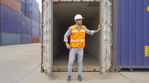 Logistic worker engineer man working in cargo container warehouse industry factory site