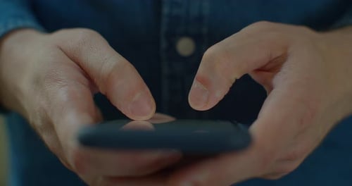 Hands Typing on Mobile Phone Close Up