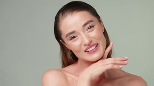 Attractive Young Woman Posing in Studio Close Up