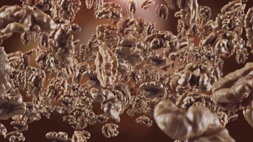 Shelled Walnuts Floating on a Brown Background