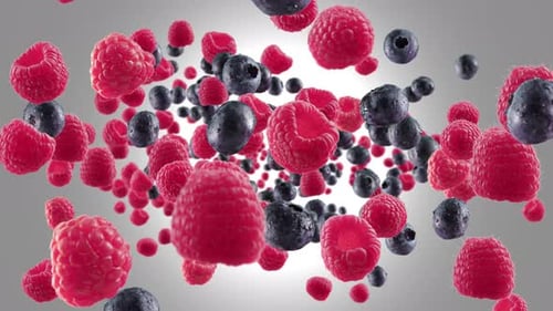 Dynamic Flying Raspberries and Blueberries Burst