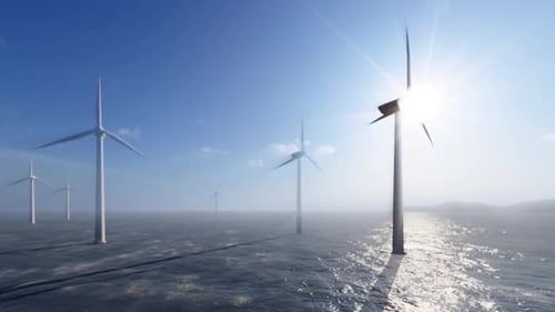 Cinematic Offshore Wind Turbines in Ocean with Blue Sky