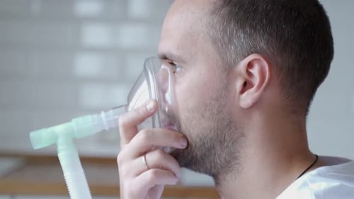 Man Is Having Inhalation at Home