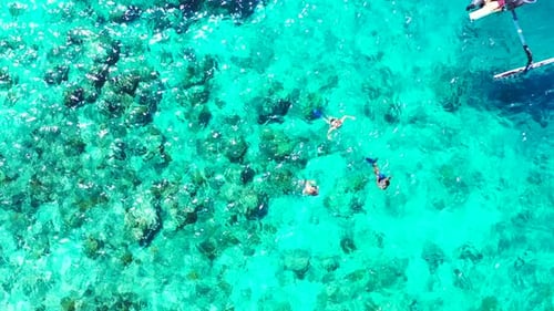 Aerial top down landscape of beautiful resort beach time by blue green ocean and clean sandy backgro
