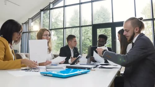 Diverse Team Working Together in Bright Conference Room