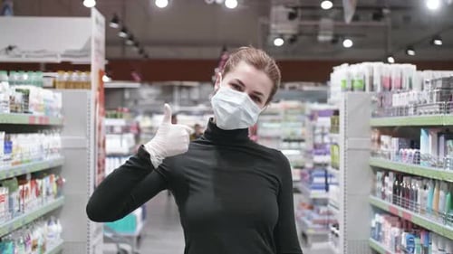 Pandemic Portrait of a Young Tourist Woman Wearing Protective Mask on Street Crowd People