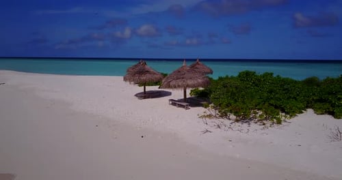 Luxury birds eye island view of a paradise sunny white sand beach and turquoise sea background in vi