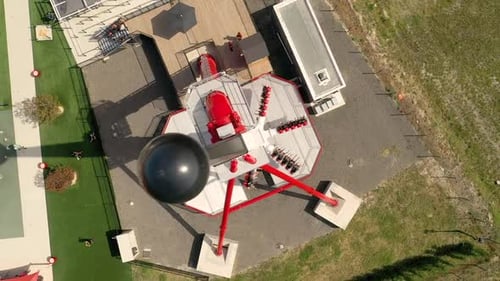Aerial view above of people riding at pendulum at Spirou Park, Provence.