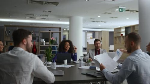 Diverse Team Meeting at Modern Office Conference Table
