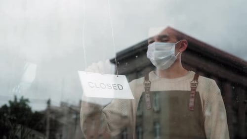Waiter Turn Open Close Sign Entrance Door While Reopening Cafe During COVID19 Epidemic