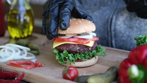 Making Burger Putting Second Half of a Bun Finishing Sandwich Assembling