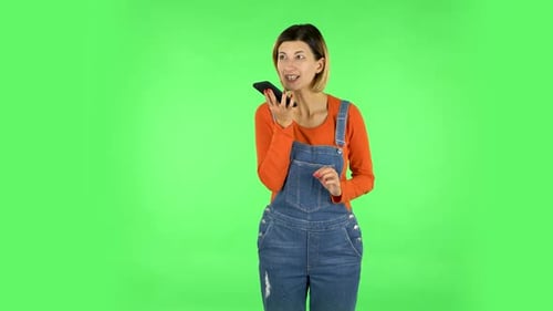 Girl Asks for Information on the Network Via Phone on Green Screen