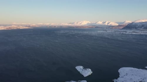 Sea and snow covered coast, Tromso, Norway