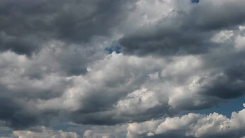 Sky time lapse with moving turbulent clouds on blue sky.