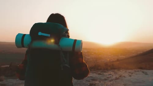 Female Hiker Enjoying Sunrise Mountain Top View