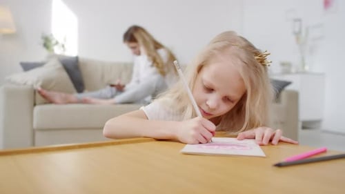 Little Girl Making Birthday Card for Mom