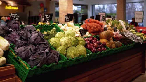 Fresh Vegetables with Price Tags on Supermarket Shelves. Cabbage, Onions, Potatoes, Pumpkin Are Sold