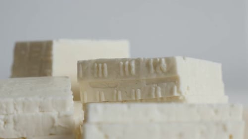 Fork Pierces Cubes of White Cheese