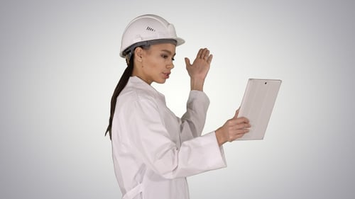 Woman Wearing Hard Hat Having Video Conference