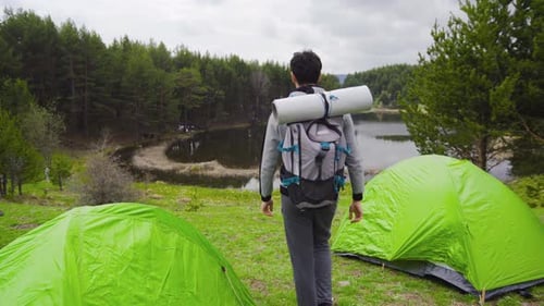 Backpacker Enjoys Scenic Lake View