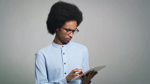 Man Uses Tablet Device