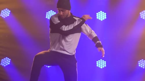 Male Dancer Dancing Break Dance, Hip Hop, Street Dancing in the Studio, Isolated. A Young Man