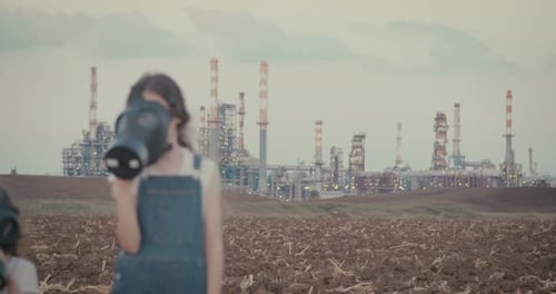 climate change crisis. Kids wearing gas masks near an oil refinery