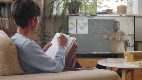 Child Watches Math Lecture and Copies Notes