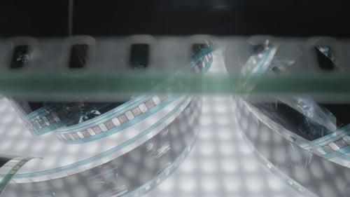 Close Up of 35mm Film Moving on Light