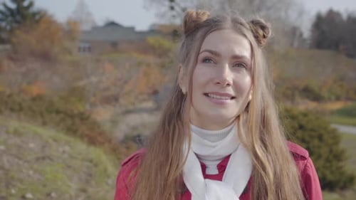 Smiling Woman Posing in an Autumn Park