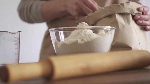 Flour Being Added to Bowl for Baking