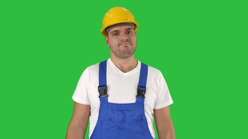 Man in Hard Hat Stands on Green Screen