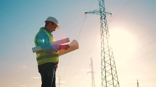 Architect Worker Checking Construction Project On Electric Tower