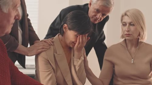 Woman Receives Comfort From Supportive Friends