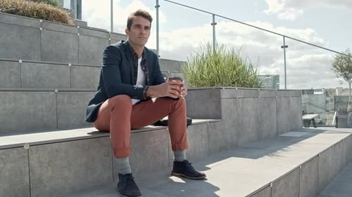 Man Drinking Coffee Outdoors