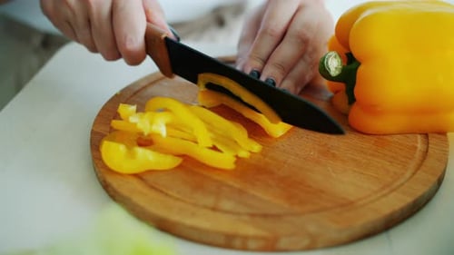 Yellow Pepper Sliced on Cutting Board