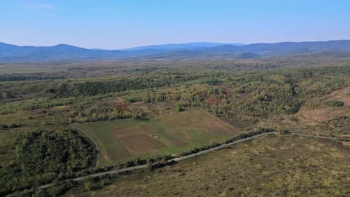 Aerial view of mountains scenic overlook forest highlands farmland field from of the countryside