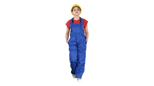 The Young Woman Engineer with Yellow Safety Helmet Walking