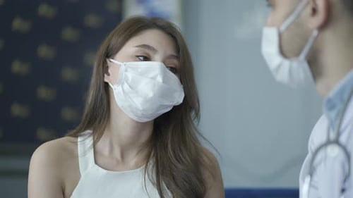 Doctor Consults Patient About Treatment in Hospital