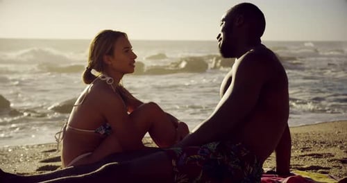 Couple interacting with each other on the beach