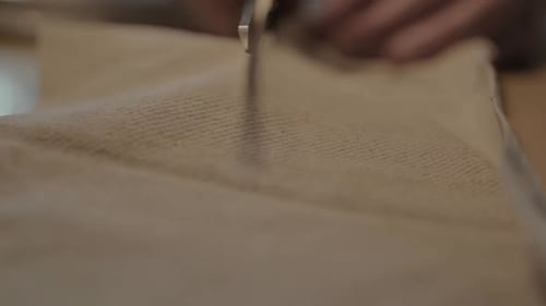 Scissors Cutting Fabric in Close Up Shot