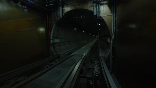 Travel Through Dark Tunnel on Rails