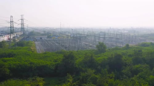 Aerial view of electricity generating, voltage poles. Power lines on utility tower and cable wires