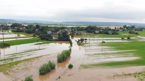 Aerial View River That Overflowed After Heavy Rains and Flooded Agricultural Fields