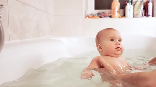 Sweet Infant Bath Time with Parent