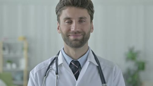 Friendly Doctor Smiling At The Camera
