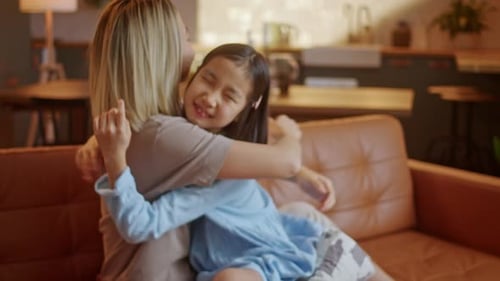 Loving Moment: Mother and Child Embrace at Home