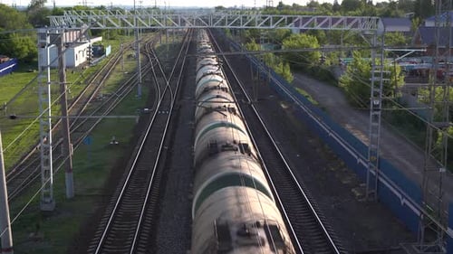 Freight Train Carries Cargo. View of the Train From Above. Rail Transport for Intercity Trade.