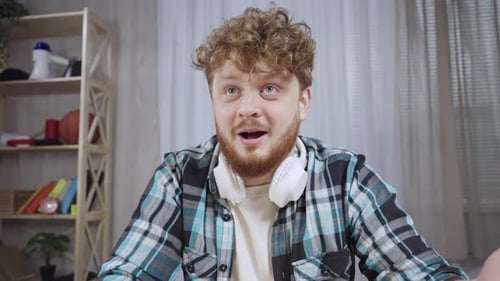 Man Smiling and Talking on Video Call