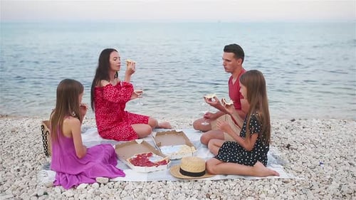 Family Having a Picnic on the Beach